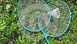 Badminton rackets in grass