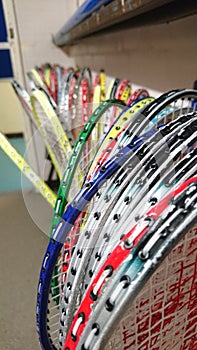 Badminton rackets stored in games cupboard