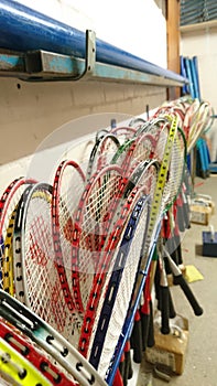 Badminton rackets stored in games cupboard