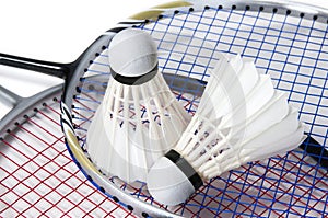 Badminton shuttlecock on racket background