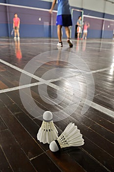 Badminton-two shuttlecocks in the badminton courts