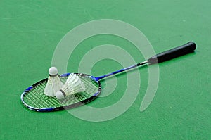 Badminton - two shuttlecocks on racket