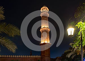 Badshai masjid the royal mosque of Mughals  in lahore at night with lights and green trees photo