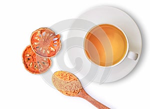 Bael fruit juice or quince tea in ceramic cup