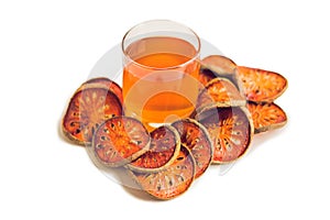 Bael fruit tea and slices of dried bael fruit, tea matum isolate