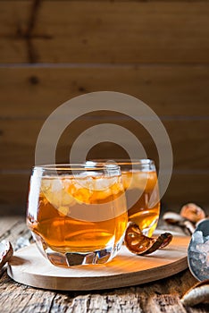 Bael juice ice tea on wooden table , healthy drink