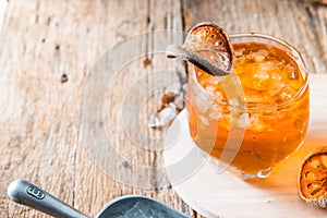 Bael juice ice tea on wooden table , healthy drink