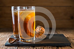 Bael juice ice tea on wooden table , healthy drink