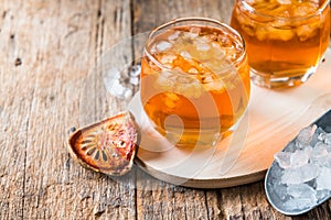 Bael juice ice tea on wooden table , healthy drink