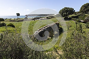 Baelo Claudia roman stone aqeuduct ancient archeological site on the spanish coast on Analusia photo