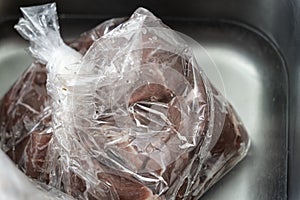 Bag of defrosted beef cubes for african pepper stew