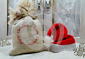 Bag of gifts and santa hat- The magic of Christmas