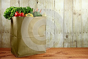 Bag of Grocery Produce Items on a Wooden Plank