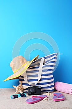 Bag with hat, flip flops, camera