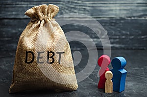 A bag of money with the word Debt and the family. The concept of debt for property. Mortgage. Real estate, home savings, loans