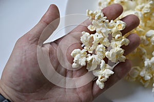 A bag of popcorn open on a plate in the kitchen