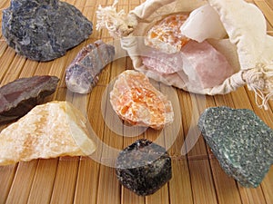 Bag with raw gemstones for water revitalization photo