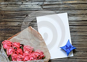 Bag of roses with blank paper and gift box