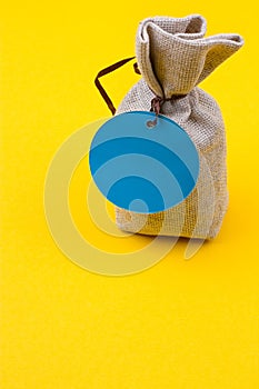 Bag of sackcloth with a blue tag