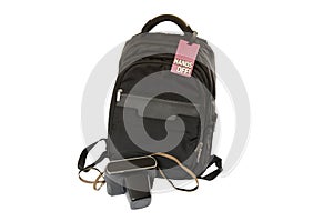 Bag with sign on it and camera on white background