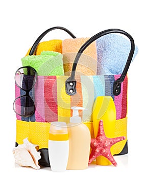 Bag with towels, sunglasses and beach items