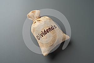 Bag with the word Dividends. Payment of dividends to officials.