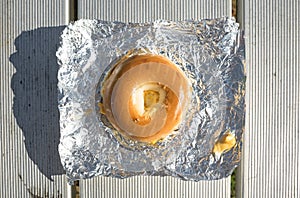 Bagel breakfast sandwich on tinfoil