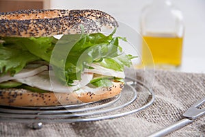 Bagel with chicken roll, green salad and cream cheese