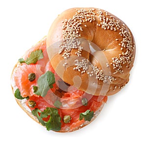 Bagel with red fish and soft cheese isolated top view