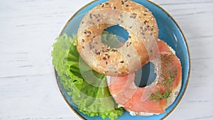 Bagel with salmon and cream cheese, top view