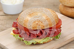 Bagel sandwich for breakfast with salami ham
