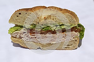 Bagel sandwich with turkey breast, lettuce and tomato