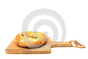 Bagel on a wooden plate