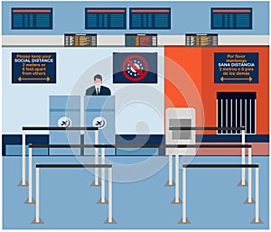 Baggage check-in area at the airport with signs indicating social distancing in english and spanish