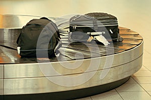 Baggage on conveyor belt at the airport. Abstract luggage line