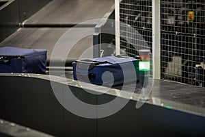 Baggage on a conveyor belt inside a luggage sorting system at an airport