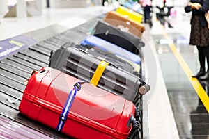 Baggage luggage on conveyor carousel belt at airport arrival