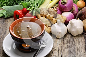 Bagna cauda(Italian Piedmont cuisine) is a hot dip made from garlic and anchovies. photo