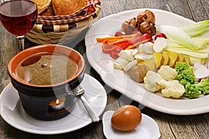 Bagna cauda(Italian Piedmont cuisine) is a hot dip made from garlic and anchovies. photo