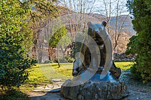 Sculpture of a brown bear, emblem of the Pyrenees, in a park in BagnÃÂ¨re de Luchon, Haute Garonne, Occitanie, France photo
