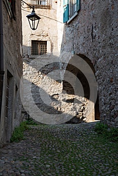 Bagolino medieval village, arched under passage. photo