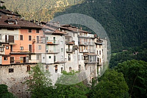 Bagolino medieval village. Old buildings and forested slopes. photo