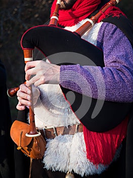 Bagpipe player outdoors