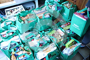 Bags with all kind of foods collected by 1 man before christmas to attack poverty.
