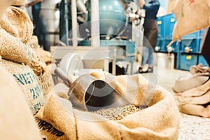 Bags of coffee in roastery or wholesale storage photo