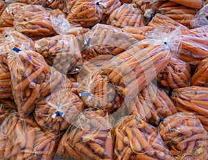 Bags of fresh garden carrots for sale sweet and delicious