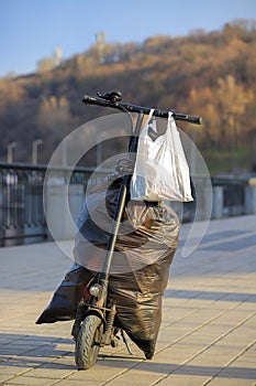 Bags of garbage on an electric scooter