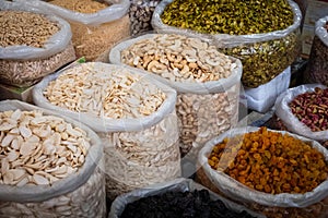 Bags of nuts, seeds and raisins, food ingredients on market Suq, Damascus photo