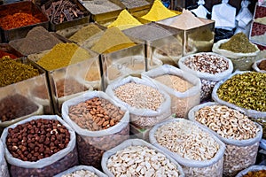 Bags of nuts, spices and ingredients for sale on food market Suq, Damascus photo