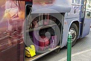 Bags and suitcases in the luggage compartment on a tourist bus